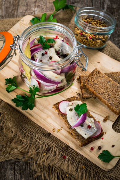 istock Pickled Marinated Herring with Spices, Radish and Red onion 1218029353