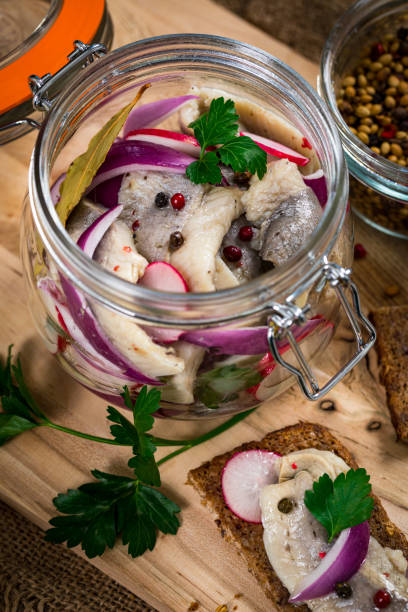 istock Pickled Marinated Herring with Spices, Radish and Red onion 1218029530