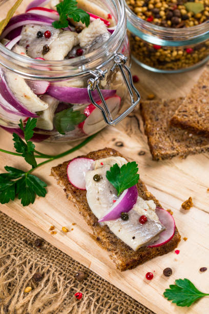 istock Pickled Marinated Herring with Spices, Radish and Red onion 1218029831