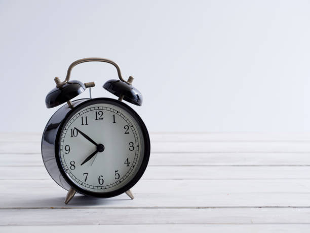 istock Old clock on white wooden plank floor vintage style. 1218029851
