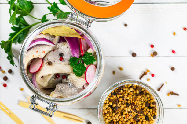 istock Pickled Marinated Herring with Spices, Radish and Red onion 1218030541