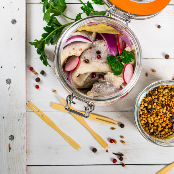 istock Pickled Marinated Herring with Spices, Radish and Red onion 1218031116