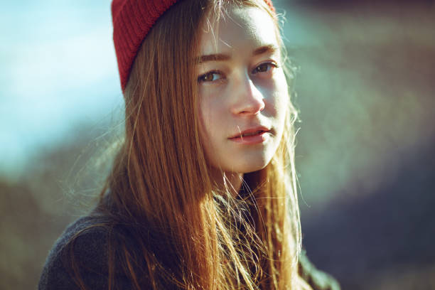 istock Beautiful hipster girl on a rocky beach. 1218031121
