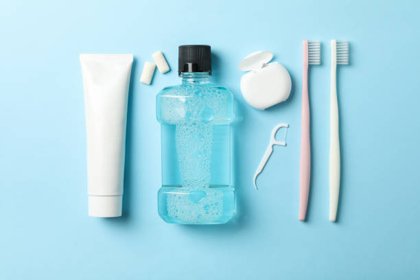 istock Flat lay with tools for dental care on blue background 1218031277