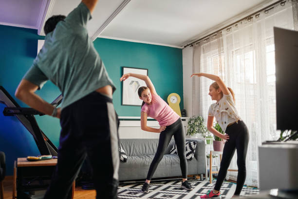 istock Family Exercise At Home 1218032787