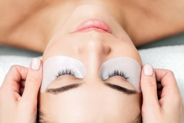 istock Hands glues ribbon under eyes. 1218033122