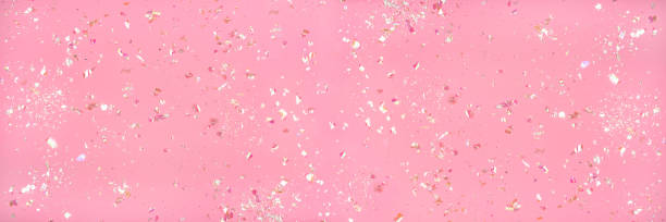 istock Pearl confetti on pink background. 1218036186