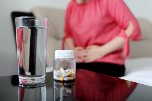 Woman suffering from pain in abdomen