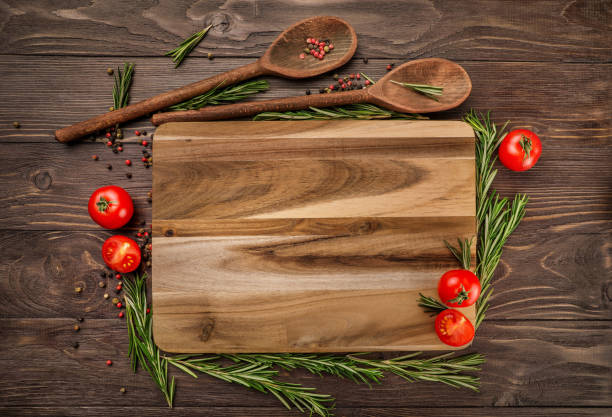 istock Tomatoes, rosemary and wooden kitchenware 1218038484