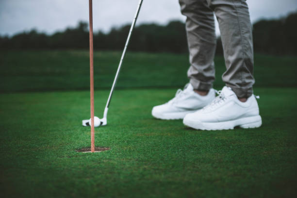 istock Low section shot of an unrecognizable young man playing golf in a golf course 1218039555