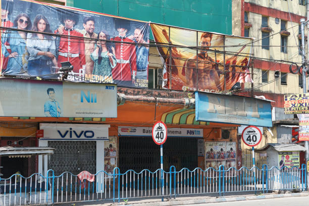A closed cinema hall and surrounding shops, during lockdown in city to combat the spread of coronavirus. Several regional Hindi movie posters and flex banners are seen outside the movie hall. \nAs of 12th April, 2020, confirmed cases in India is 8,356 while 273 people have died after being tested Covid-19 positive.\n\nPhoto taken in Kolkata on 04/09/2020, 16th day of pan India lockdown.