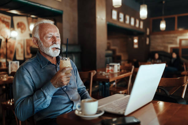 istock Senior Man Working Coffee Shop Realxation Concept 1218040878