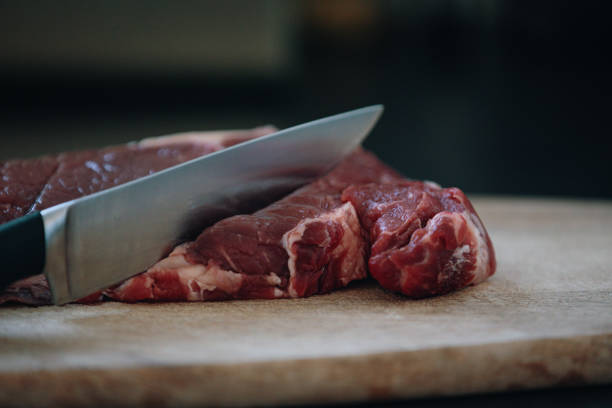 istock Cutting of Beef in Butcher 1218044928