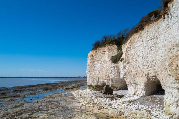 The white chalk cliffs for Ramsgate west looking towards Pegwell Bay on a late spring day with blue sky.