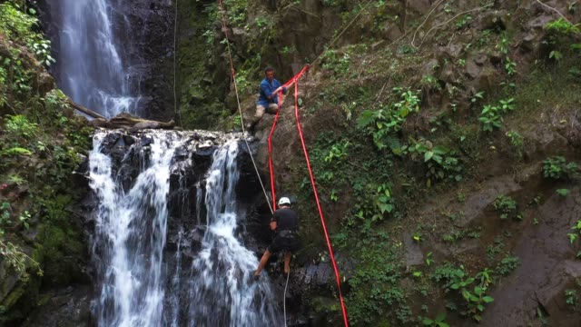 Rappelling down a tropical waterfall in Costa Rica