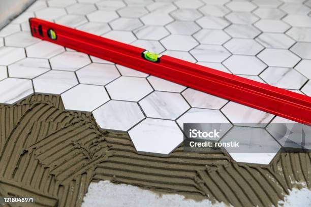 Tiling Laying Marble Texture Hexagon Tiles On The Floor Stock Photo - Download Image Now
