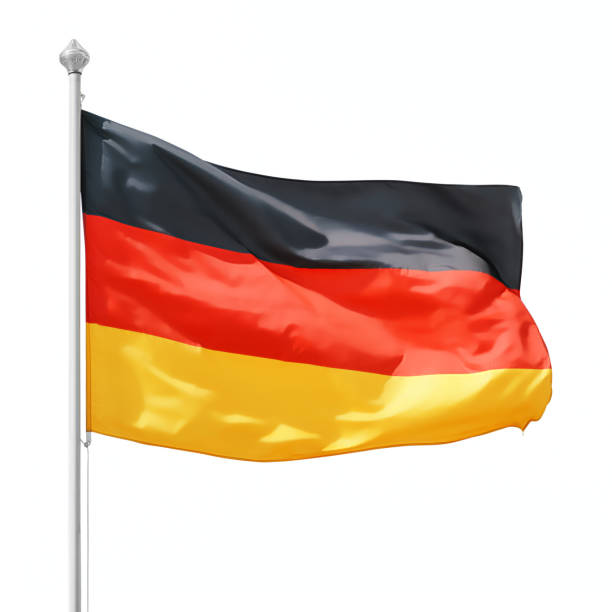 istock German flag on flagpole isolated with clipping path 1218049858