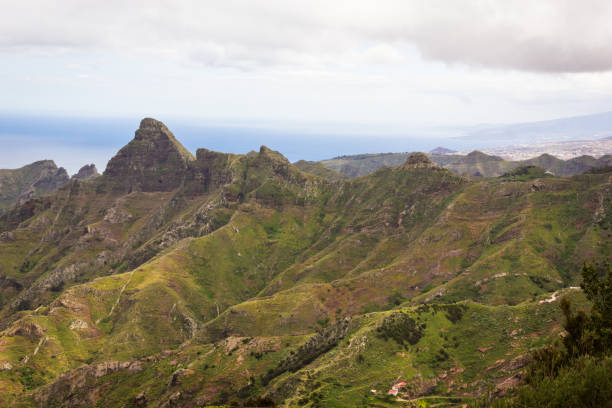 istock Green mountain range with clouds shadows passing by in north Tenerife, Spain 1218051634