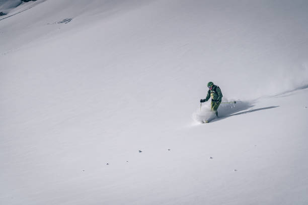 istock Backcountry skier descends mountain 1218052463