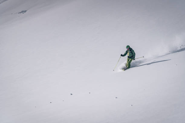 istock Backcountry skier descends mountain 1218052572