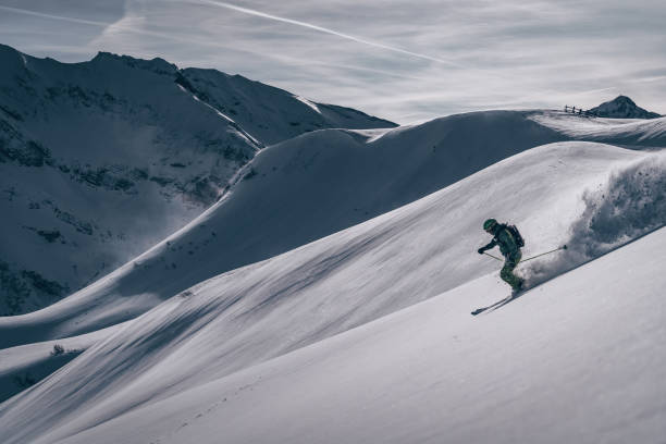 istock Backcountry skier descends mountain 1218052792