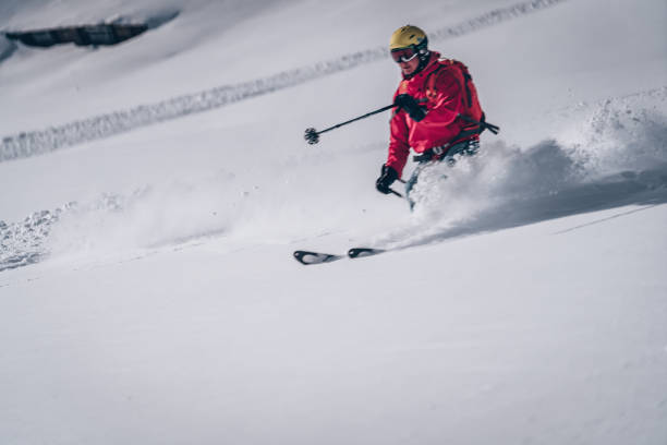istock Female backcountry skier descends mountain 1218052813