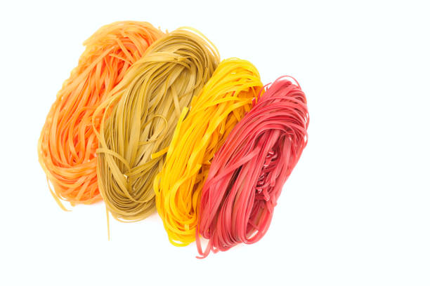 istock Isolated colored spaghetti nests on a white background 1218055861