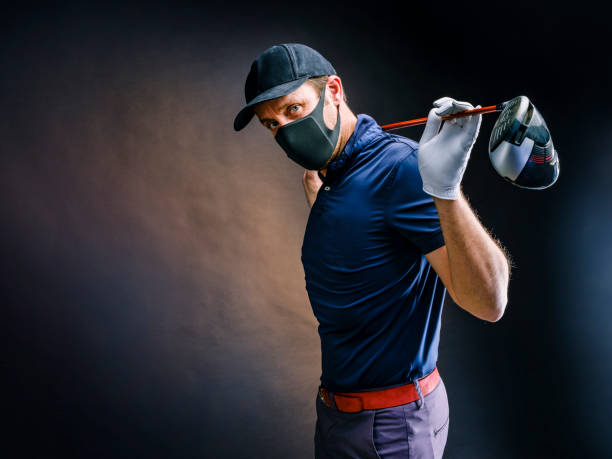 golf player with golf club and protection mask - golf swing golf golf club golf ball imagens e fotografias de stock
