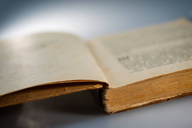 istock pages of an open old book lying on a table 1218060090