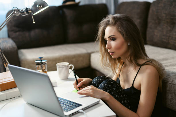istock Young woman working successfully at home using laptop. Coronavirus. Quarantine. isolation, social distancing, freelance work from home office, self-isolation. 1218061464