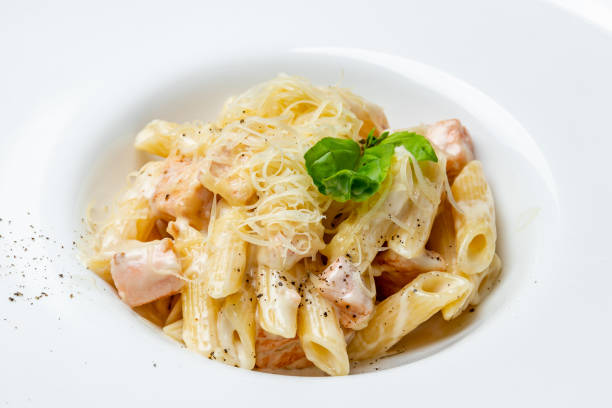 istock Penne with salmon on white plate 1218063078