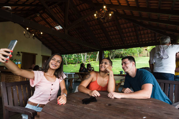istock friends taking selfie at home recreation area 1218065504