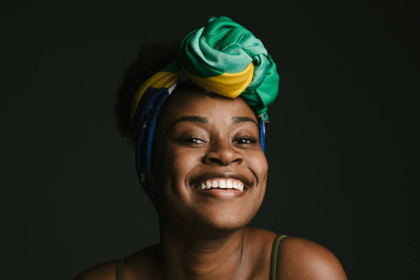 Smiling and relaxed woman Black woman, turban, Brazilian flag, young woman, love for Patria, Brazilian people, one woman teeth photos stock pictures, royalty-free photos & images