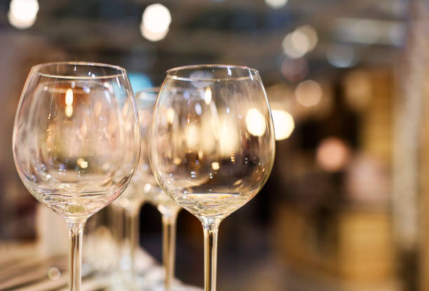 istock Wine glasses on the shelf closeup, houseware store 1218066422