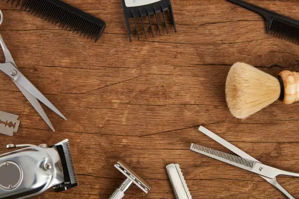 Photo of Mens hairdressing desktop with tools for shaving top view