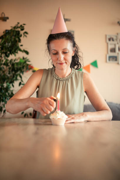 istock Woman celebrating birthday alone at home 1218070545