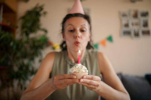 istock Woman celebrating birthday alone at home 1218070570