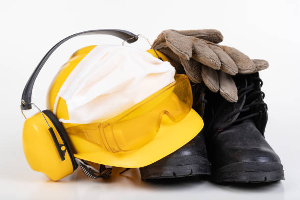 istock Protective helmet, boots, gloves and flu mask. Building accessories during the plague. Light background. 1218072889