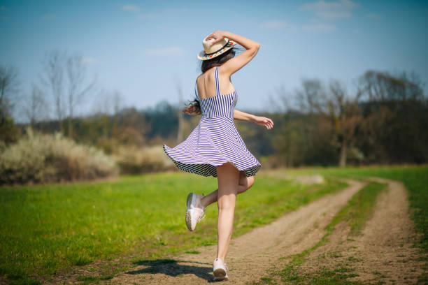 istock Young beautiful woman walking in a rural area 1218073183