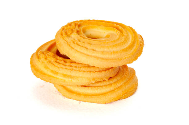 Round spritz shortbread isolated on white background. Danish butter cookies on white.