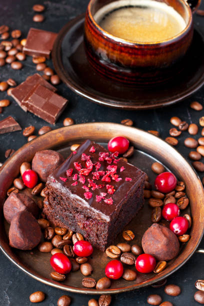 istock Still life with chocolate brownie and coffee mug on dark table 1218078325