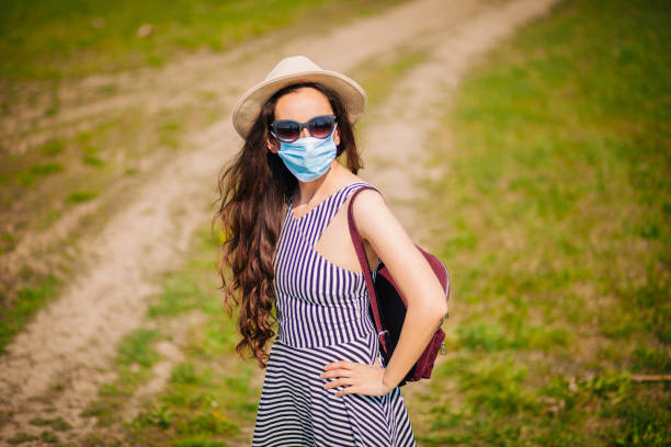 istock Woman In The Nature Wearing Protective Face Mask 1218078508
