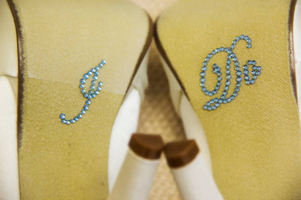 Bride’s Shoes With I Do Gems Attached To The Sole