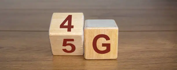 Change wooden block from 4G to 5G. Technology, network, communication concept.