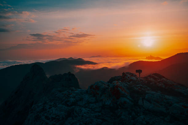 istock Sunset in the mountains in the fog 1218079890