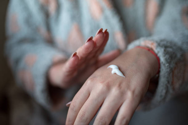 istock Woman applying hand cream 1218080827