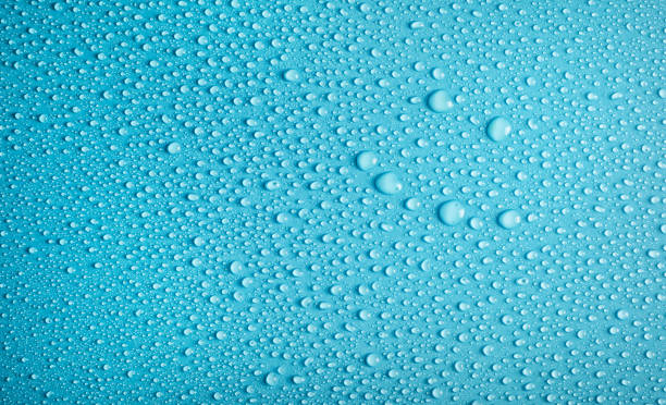 istock Happy smile on water drops blue background 1218081233