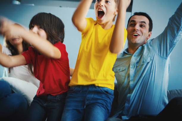 istock Family spending time at home playing video games. 1218082209