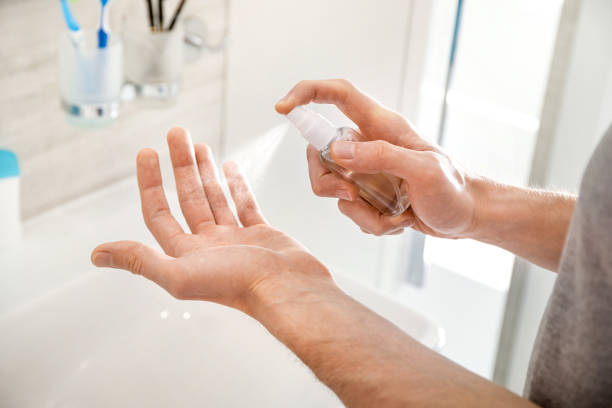 istock Hand treatment with antibacterial spray 1218082429