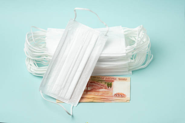 istock Stack of medical masks with Russian money 1218083430